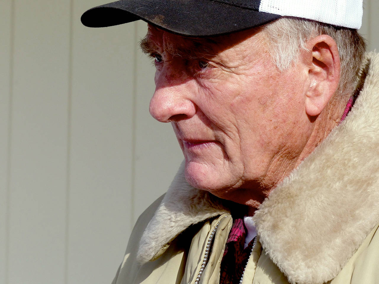 In this Jan. 2016 photo, rancher Dwight Hammond Jr. greets protesters outside his home in Burns, Oregon. President Donald Trump has pardoned Dwight and Steven Hammond, two ranchers whose case sparked the armed occupation of a national wildlife refuge in Oregon. (Les Zaitz/The Oregonian via AP, File)
