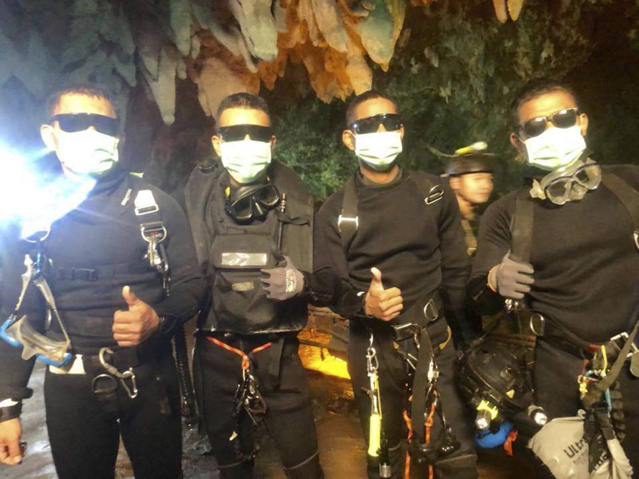The last four Thai Navy SEALs come out safely after completing the rescued mission inside a cave where 12 boys and their soccer coach had been trapped since June 23, in Mae Sai, Chiang Rai province, northern Thailand. (Royal Thai Navy via AP)