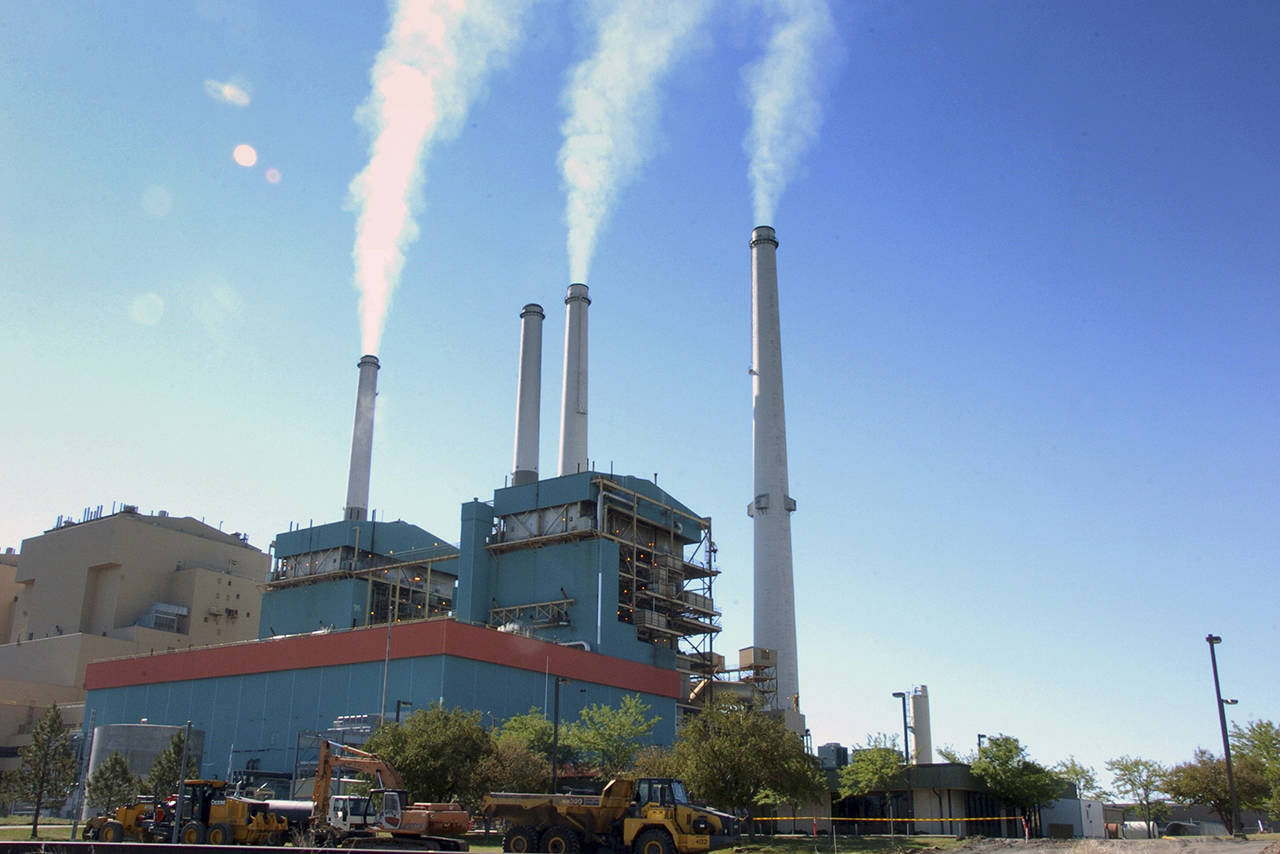 In this 2013 photo, smoke rises from the Colstrip Steam Electric Station, a coal burning power plant in Colstrip, Montana. (AP Photo/Matthew Brown, File)