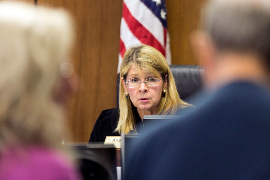 Judge Anita Farris reads Clyde Reed (right) his legal rights after he pleaded guilty Thursday at the Snohomish County Courthouse in Everett. (Kevin Clark / The Herald)
