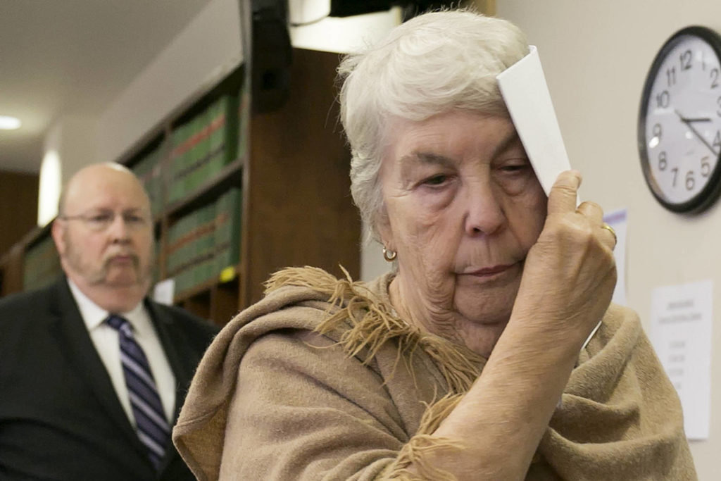 Faye Reed walks from the bench after pleading guilty Thursday at the Snohomish County Courthouse in Everett. (Kevin Clark / The Herald)
