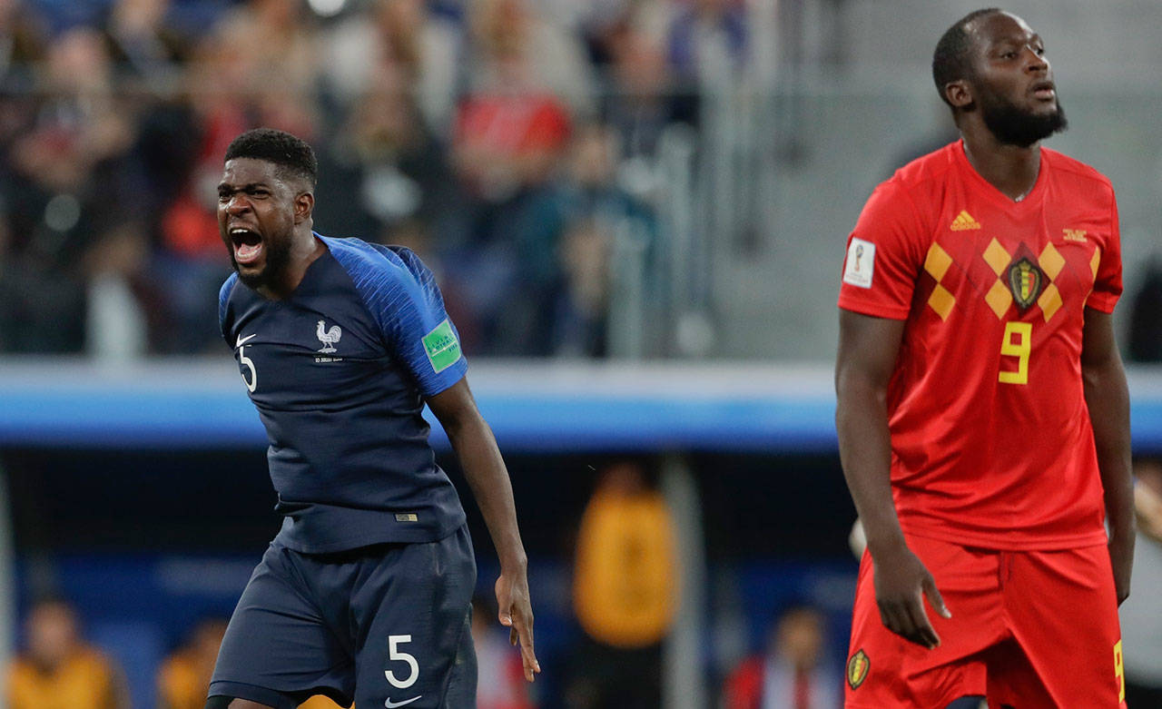 France’s Samuel Umtiti celebrates past Belgium’s Romelu Lukaku at the end of a World Cup semifinal match on July 10, 2018, in St. Petersburg, Russia. France won 1-0. (AP Photo/Petr David Josek)