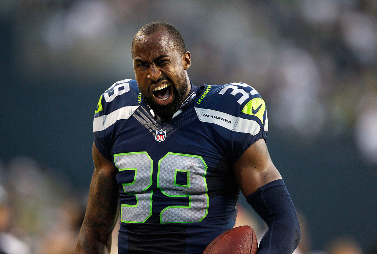 Former Seahawks cornerback Brandon Browner scowls after scoring on a 106-yard fumble return during a preseason game against the Broncos in 2013. (Jennifer Buchanan / The Herald)