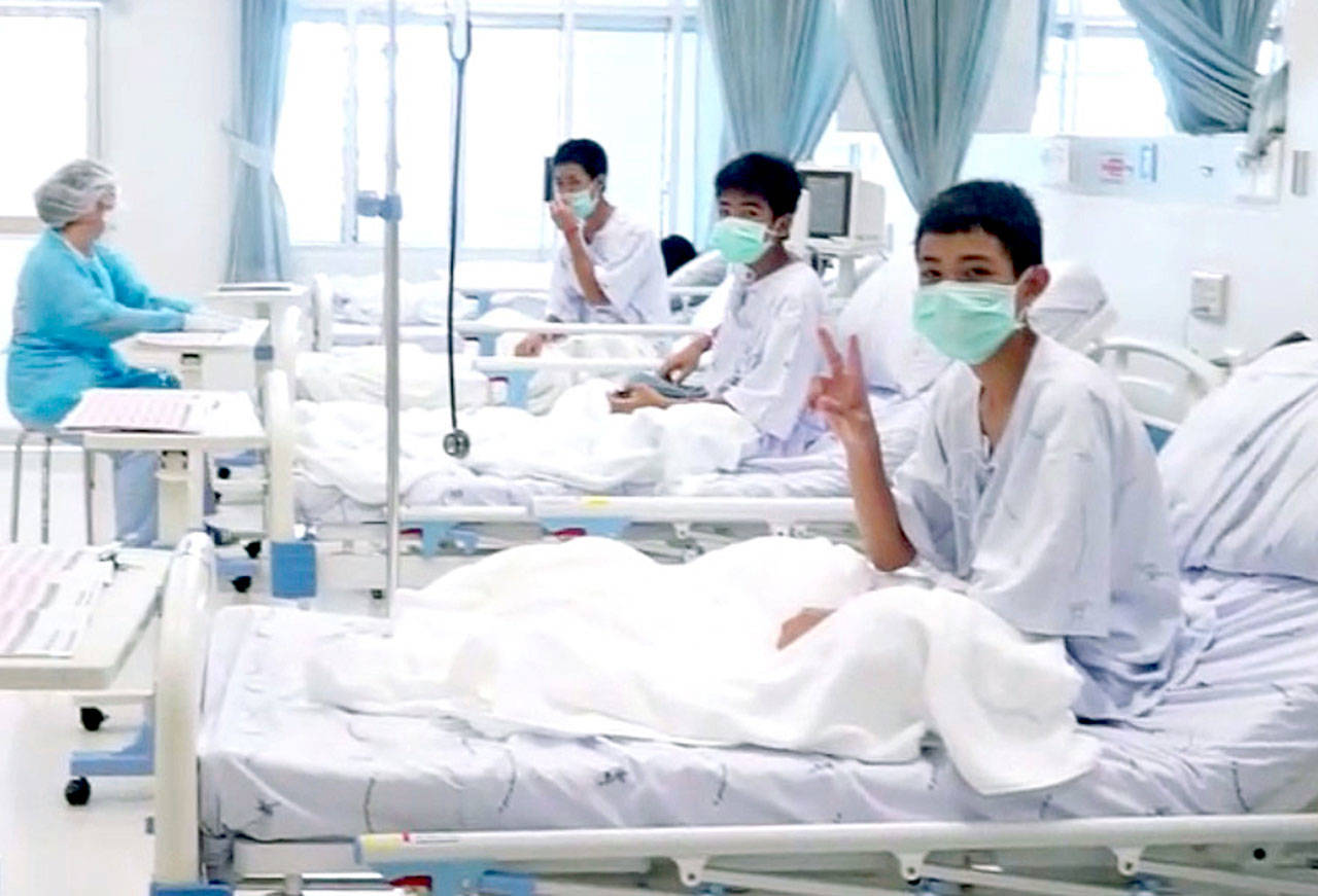Three of the 12 boys recovering in their hospital beds after being rescued with their coach from a flooded cave in Mae Sai, Chiang Rai province, northern Thailand. (Thailand Government Spokesman Bureau via AP)