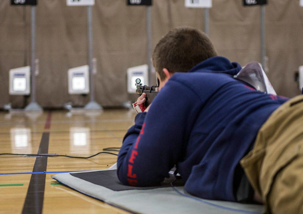 Hunter Pyeatt lines up his sight with the target during CMP Air Rifle Marksmanship Camp at Snohomish High School on Thursday, July 12, 2018 in Snohomish, Wa. (Olivia Vanni / The Herald)

