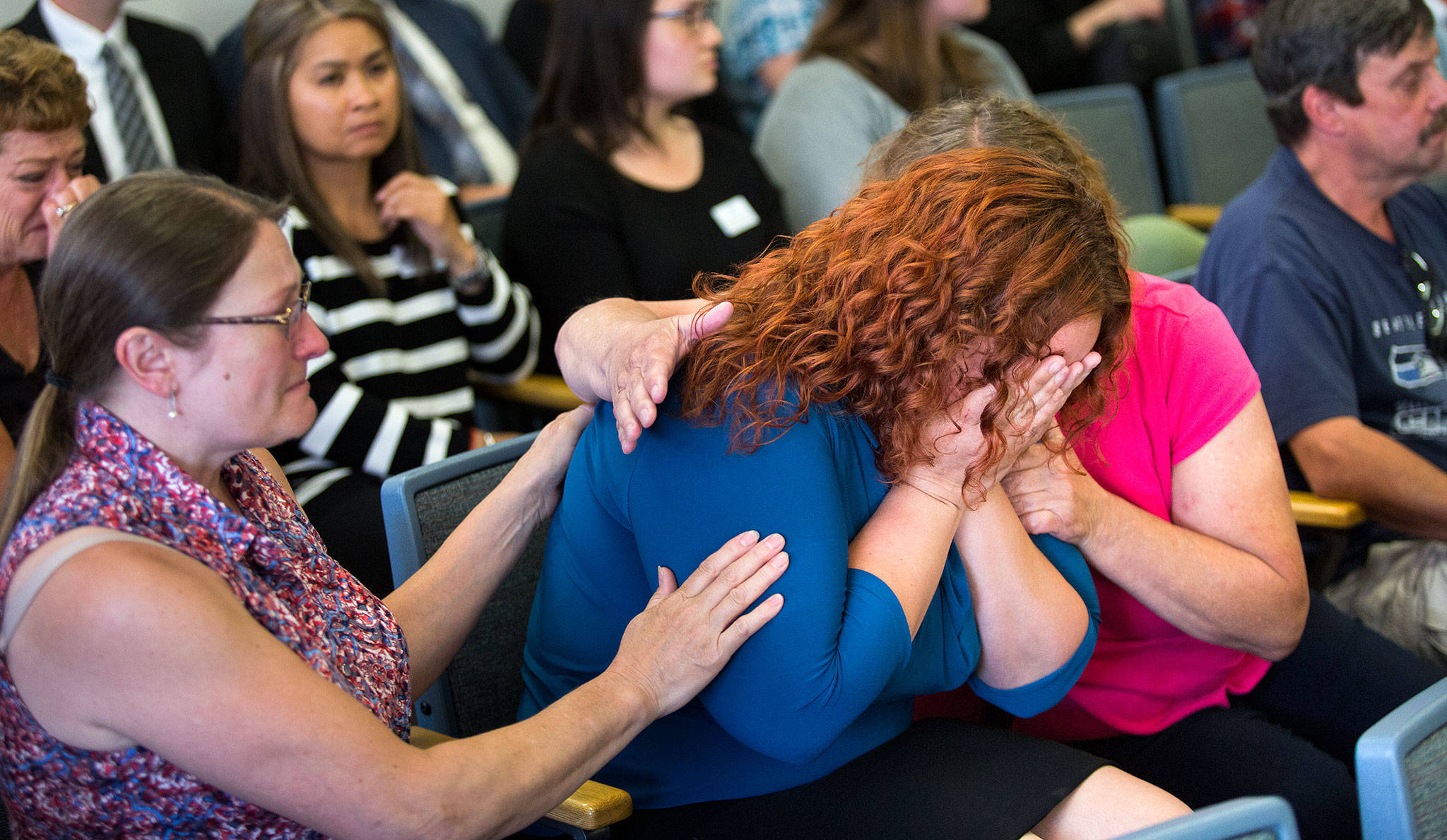 Melissa McCawley is comforted by relatives after hearing that Todd Eugene Brown, 52, is found not guilty at the Snohomish County Courthouse on Thursday in Everett in the deaths of her daughter, Amiyah Johnson, 12, and her niece, Yesterday Wallace, 2. A judge found Brown not guilty of being impaired by methamphetamine when a crash killed the two cousins on I-5 near Lynnwood, even though his blood tested positive for drugs. (Andy Bronson / The Herald)