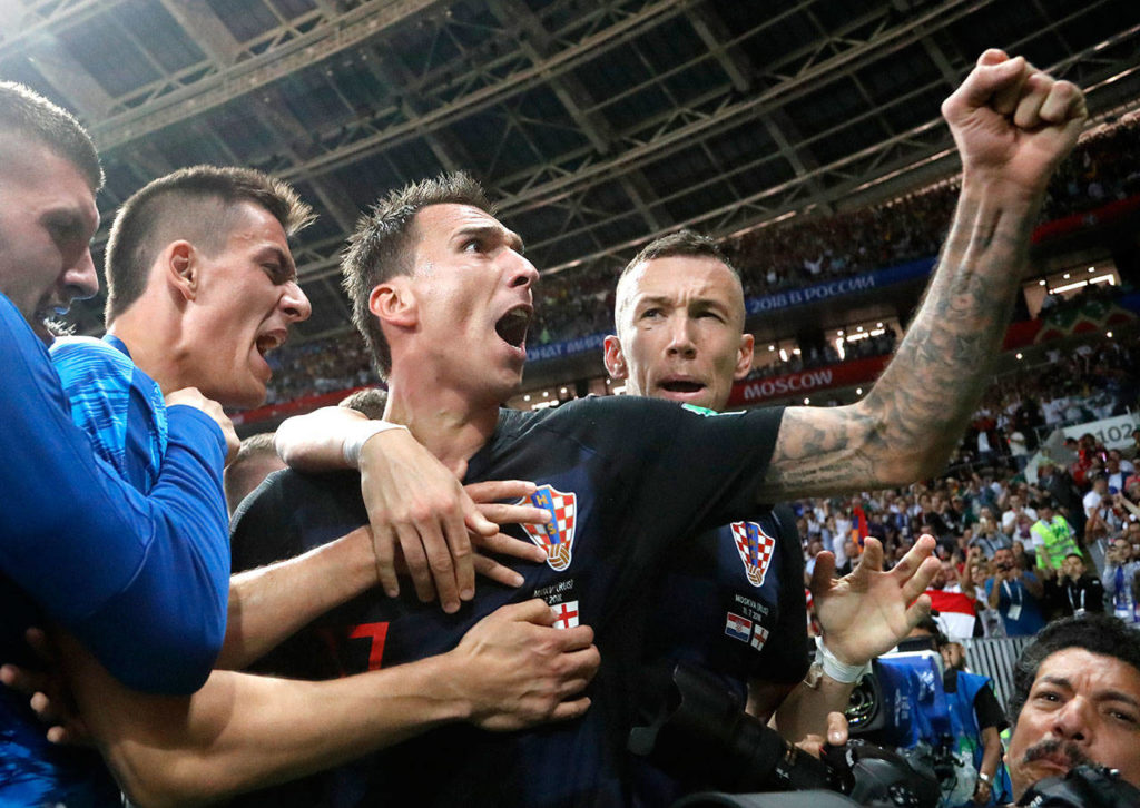 Croatia’s Mario Mandzukic, center, celebrates Wednesday, July 11, 2018 after scoring his side’s second goal during the semifinal match between Croatia and England at the 2018 soccer World Cup in the Luzhniki Stadium in Moscow, Russia. (AP Photo/Frank Augstein)
