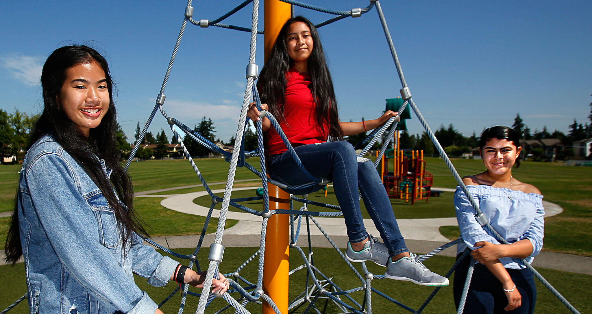Kayleen Yonn (from left), 15, Brittany Mendez-Hernandez, 14, and Careana Willis, 15, meet at Walter E. Hall Park where, on Saturday, they’ll help with Mobile Dental Day. It’s a project of Leadership Launch. (Dan Bates / The Herald)