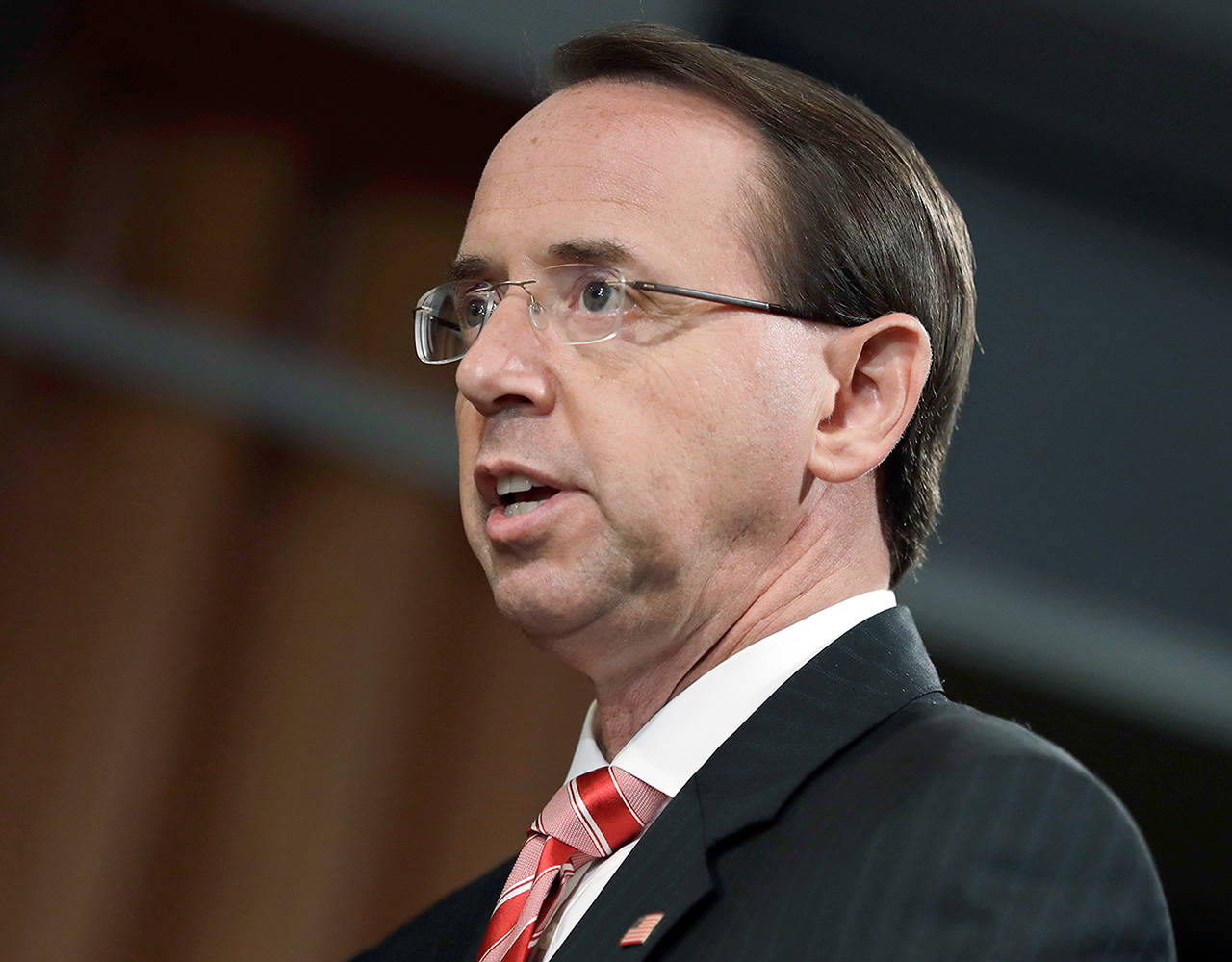 Deputy Attorney General Rod Rosenstein speaks during a news conference at the Department of Justice on Friday in Washington. (AP Photo/Evan Vucci)