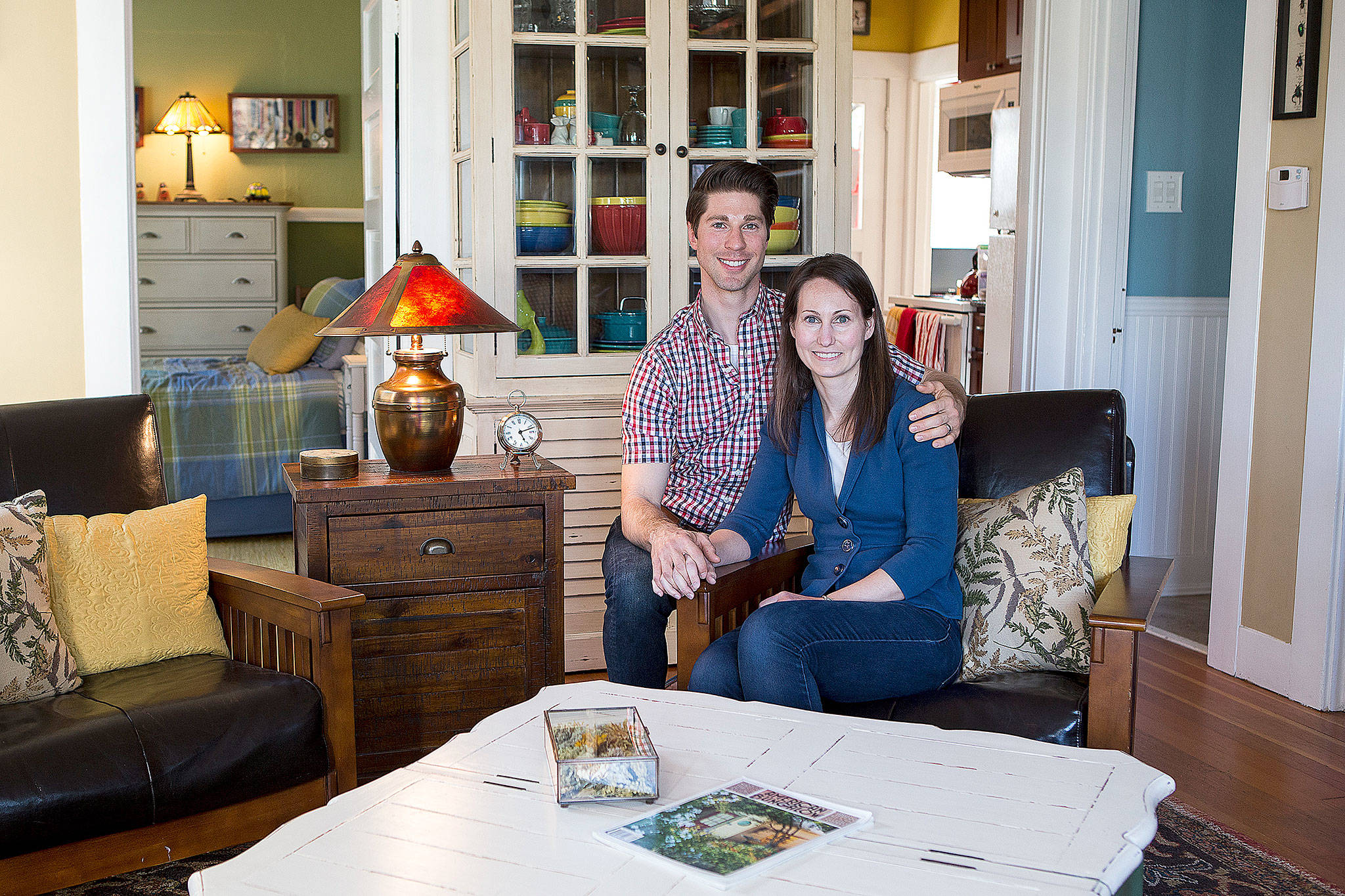 Alyssa and Clinton Seal are pictured in the living room of their craftsman home in Everett. (Ian Terry / The Herald)