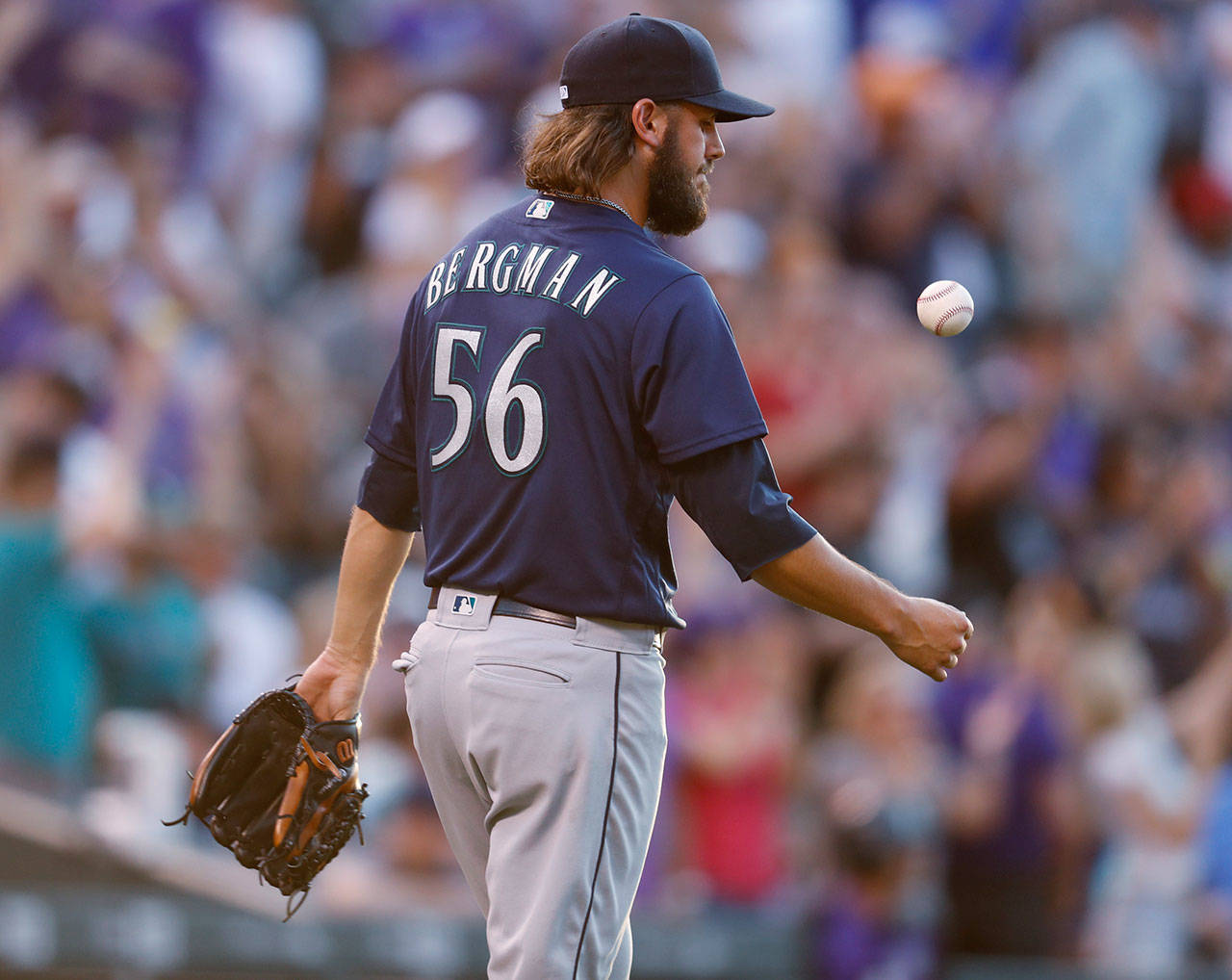 Seattle’s Christian Bergman reacts after giving up a two-run home run to Colorado’s Trevor Story in the third inning of Friday’s game in Denver. (AP Photo/David Zalubowski)