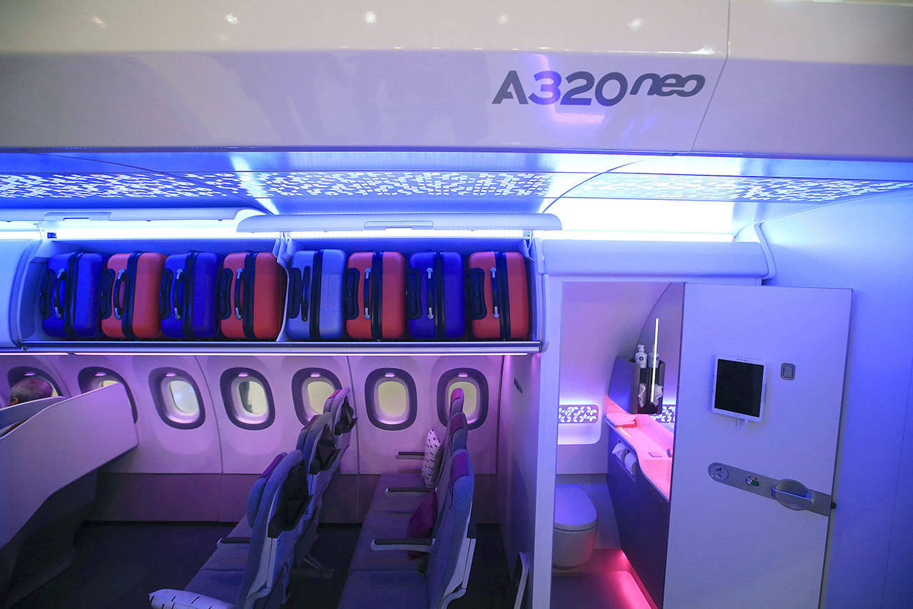 A restroom door stands open inside a new Airbus A320neo at the Aircraft Interiors Expo in Hamburg, Germany. (Krisztian Bocsi / Bloomberg)