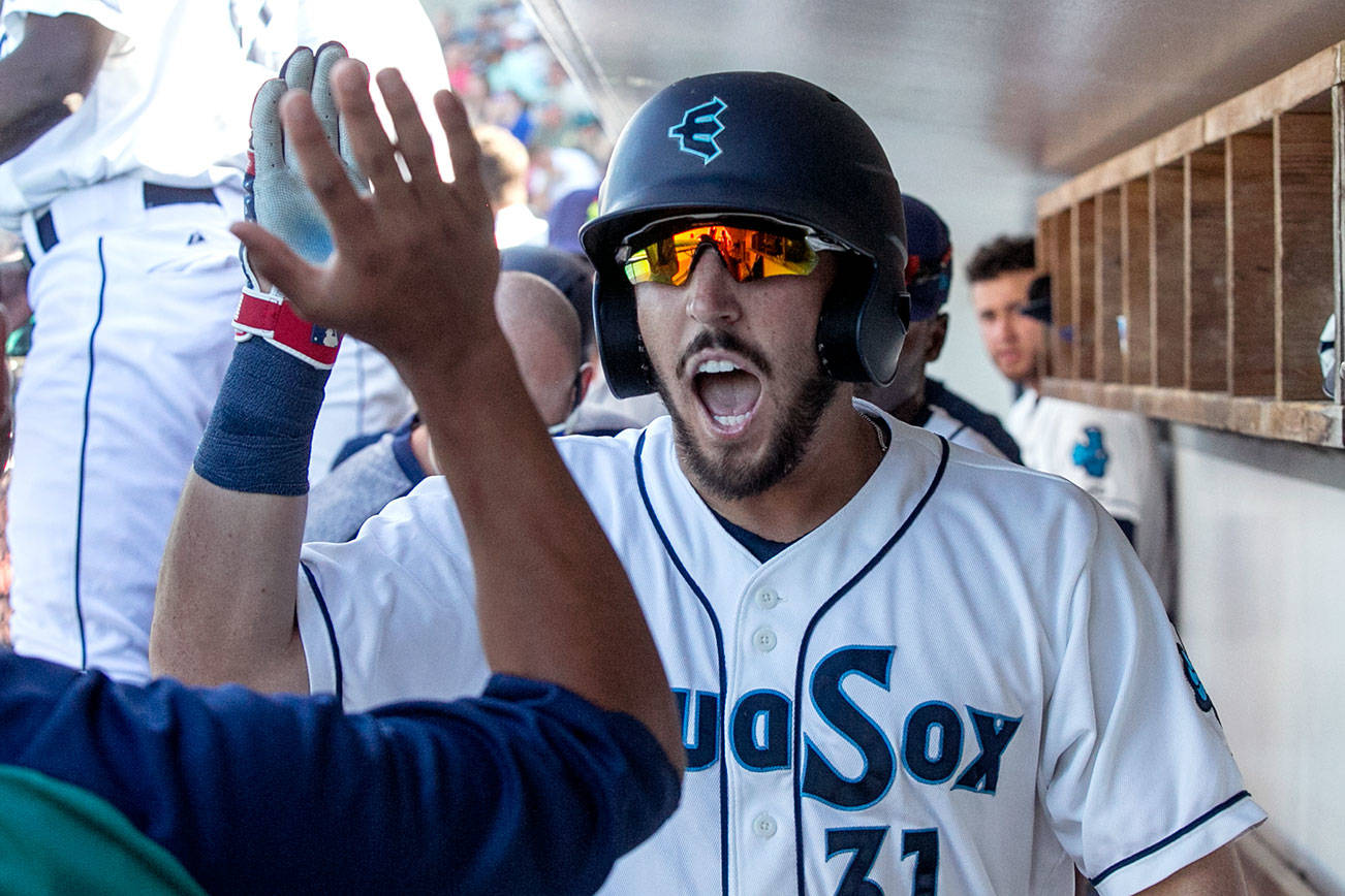 Aquasox’s Ryan Garcia celebrates his two run homer in the third inning against the Salem-Keizer Volcanos Sunday afternoon at Everett Memorial Stadium on July 15, 2018. (Kevin Clark / The Herald)