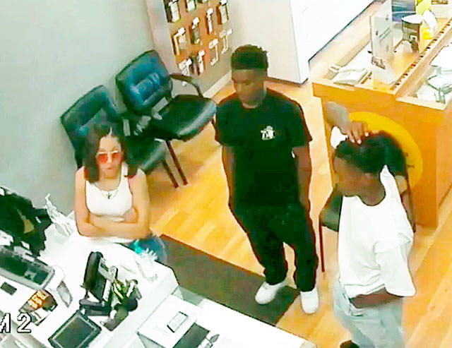 Police are searching for these three people who allegedly stole iPhones from a Monroe store Friday night. (Monroe Police Department)