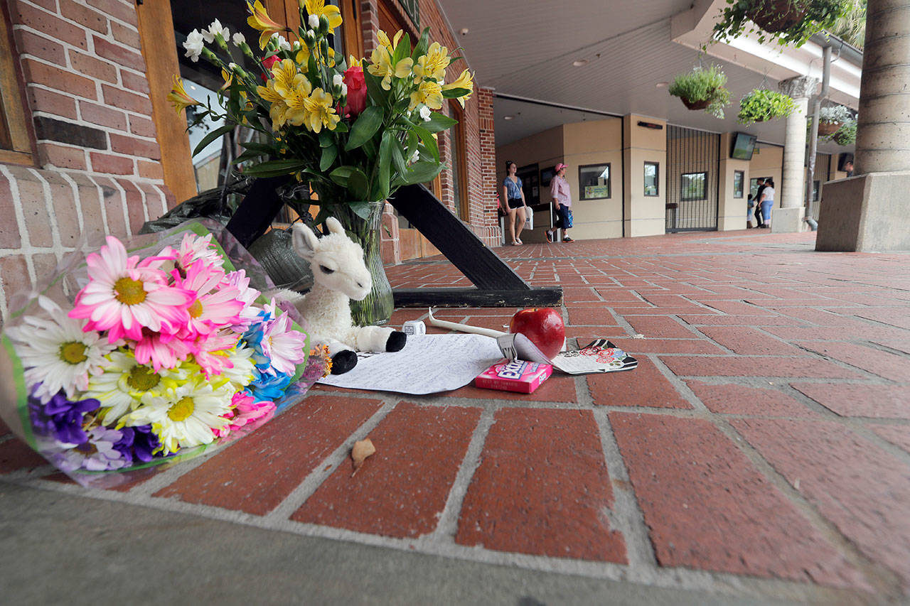 A makeshift memorial is seen outside the Audubon Zoo in New Orleans on Monday. The death of a wounded fox brings to nine the number of animals that have died as the result of the weekend escape of a jaguar. (Gerald Herbert / Associated Press)