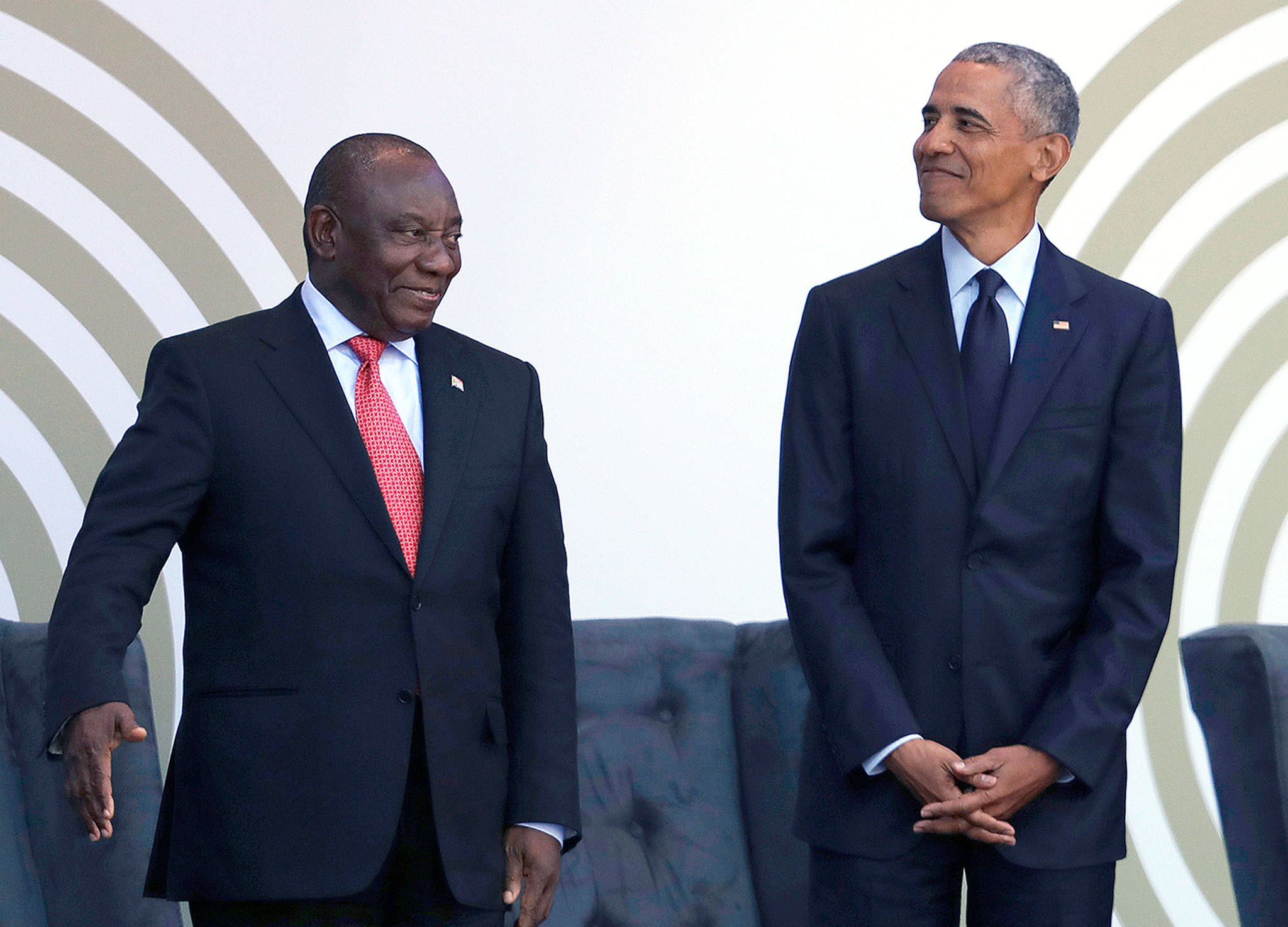 Former U.S. President Barack Obama (right) with President Cyril Ramaphosa at the Wanderers Stadium in Johannesburg, South Africa, on Tuesday, where he was to deliver the 16th Annual Nelson Mandela Lecture. (AP Photo/Themba Hadebe)