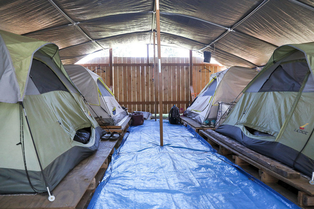 After a rainy and snowy winter, the Jean Kim Foundation, which built Shepherd’s Village, wants to replace the tents with tiny homes. (Lizz Giordano / The Herald)
