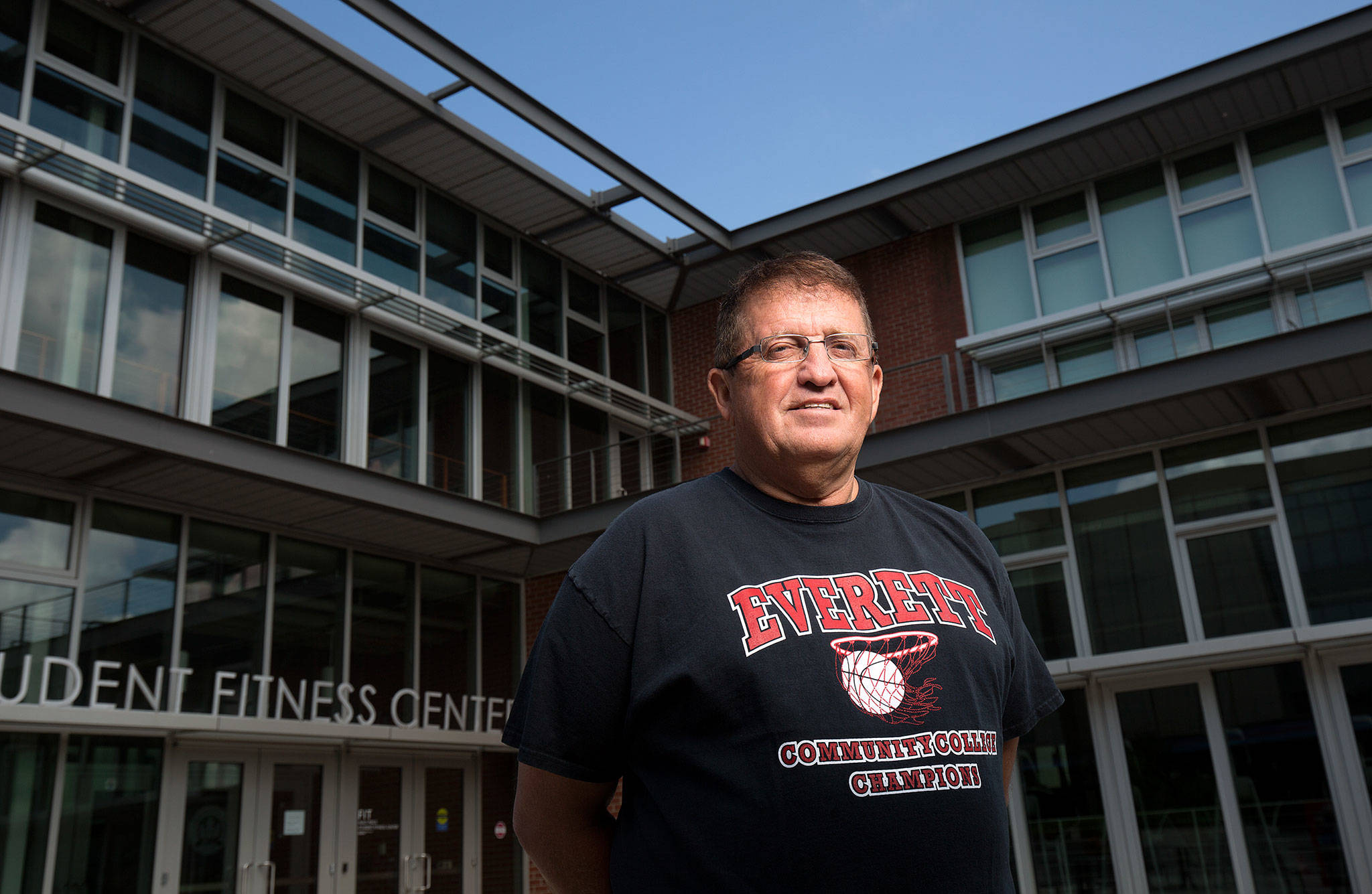 Former Everett Community College men’s basketball coach Larry Walker stands in front of the gym on July 20, 2018, in Everett. Walker is getting inducted into the Washington Interscholastic Basketball Coaches Association’s Hall of Fame on July 24. (Andy Bronson / The Herald)