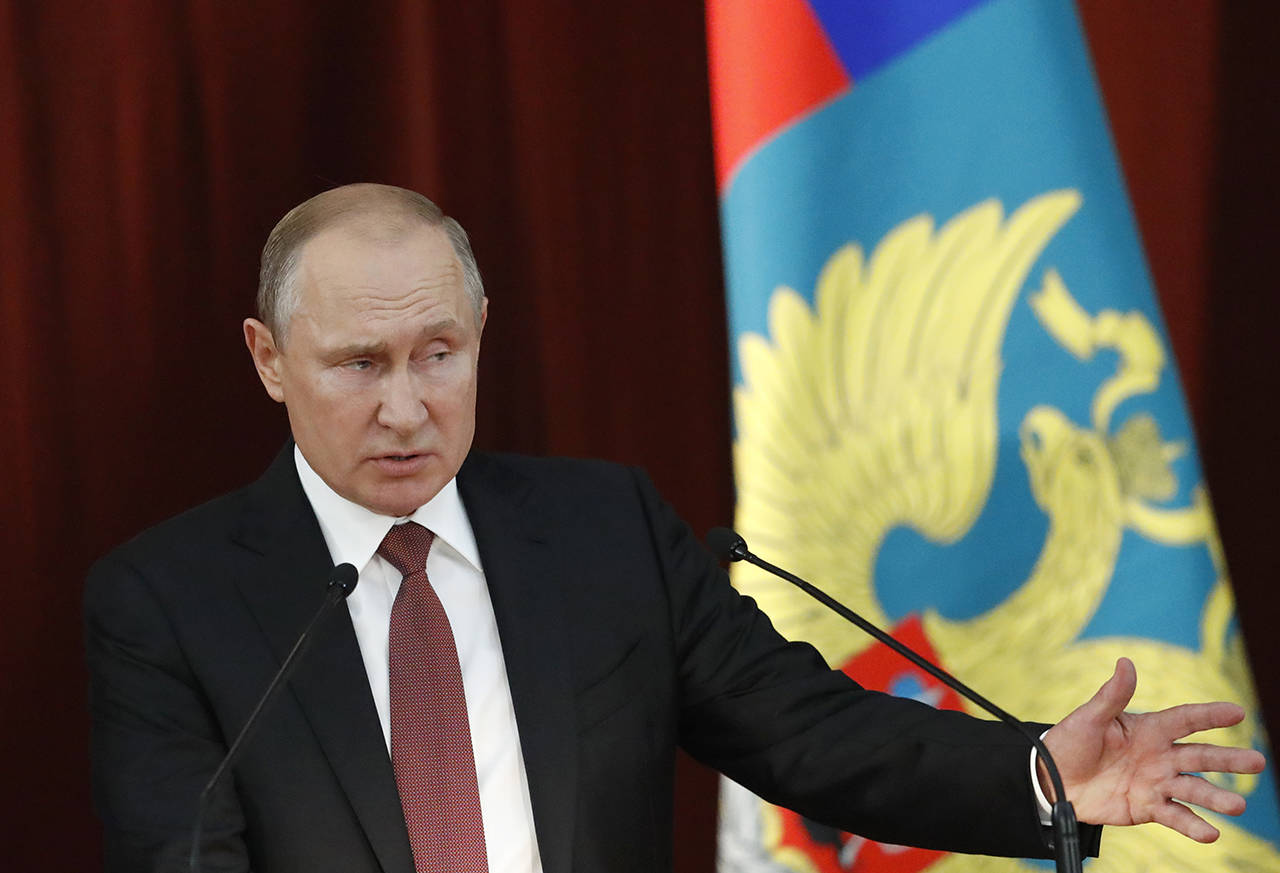 Russian Vladimir Putin gestures during a meeting with Russian ambassadors to foreign countries in Moscow, Russia, on Thursday. (Sergei Karpukhin/Pool Photo via AP)