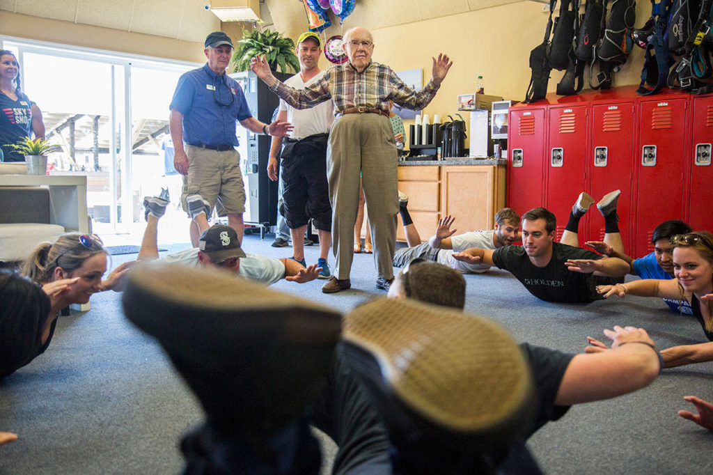 Stu Williamson does stretches with his skydiving flight before his 100th birthday skydive at Skydive Snohomish on Sunday. (Olivia Vanni / The Herald)
