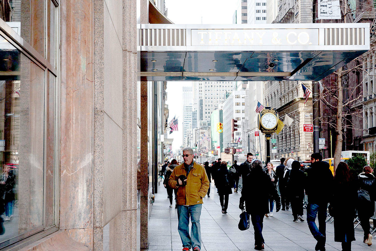 Pedestrians pass in front of the Tiffany Co. flagship store on Fifth Avenue in New York. ( Bloomberg/Sarah Blesener)