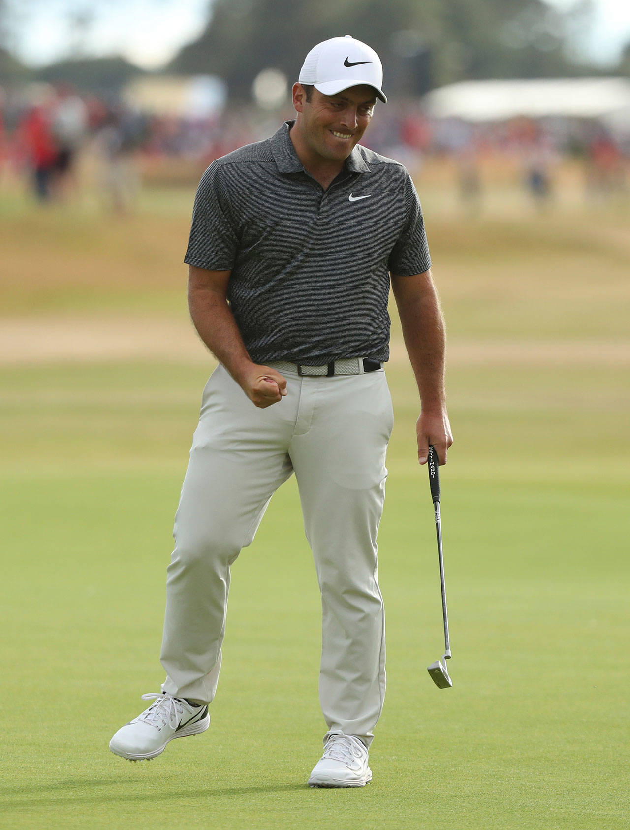 Francesco Molinari celebrates after making a birdie putt on the 18th hole Sunday during the final round of the British Open in Carnoustie, Scotland. (AP Photo/Peter Morrison)