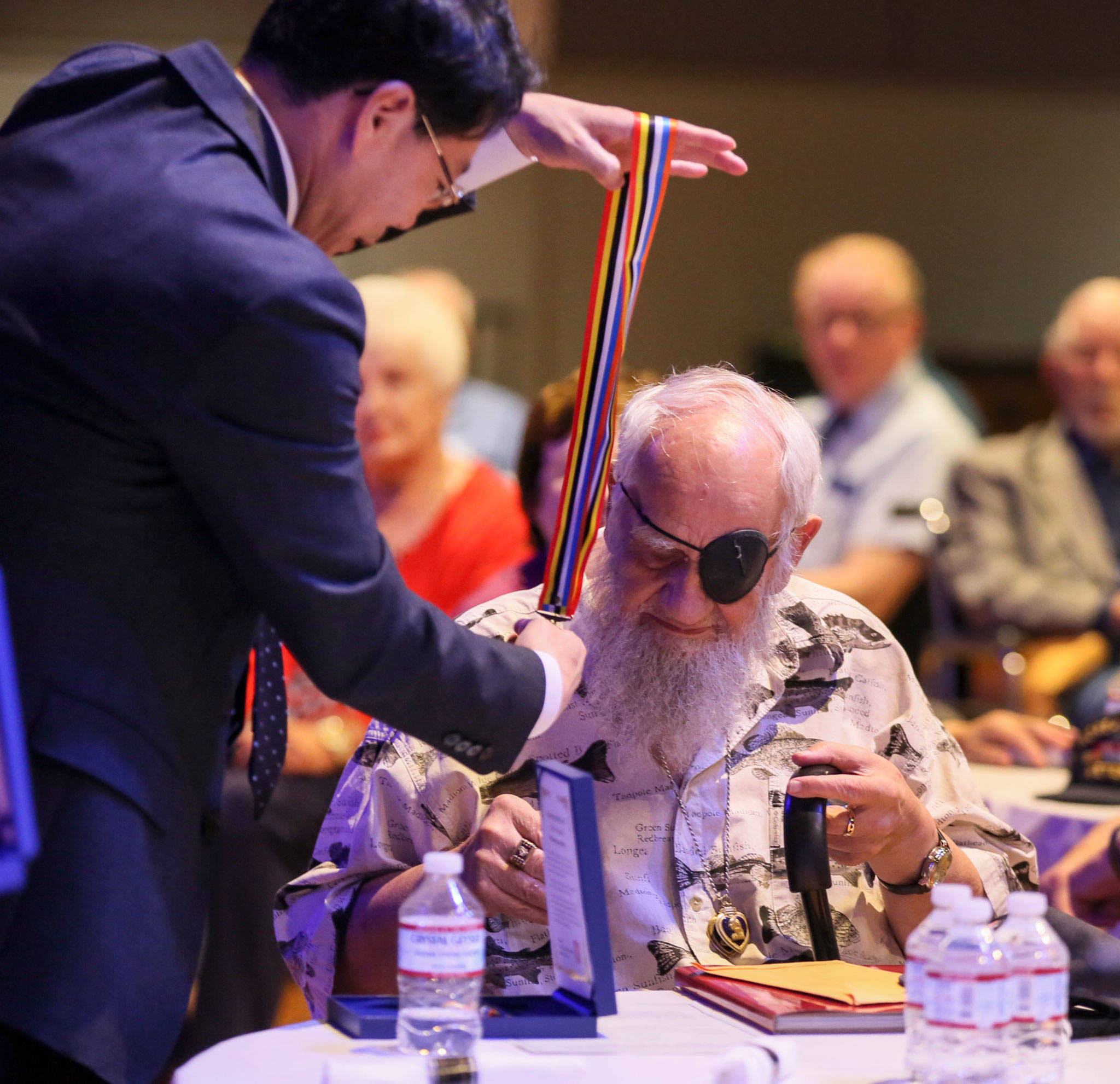 Consul General Hyung-jong Lee presents the Ambassador for Peace Medal to Freeman Nickel for his service in the Korean War during at an event Monday morning at Northwest Church in Lynnwood. (Kevin Clark / The Herald)