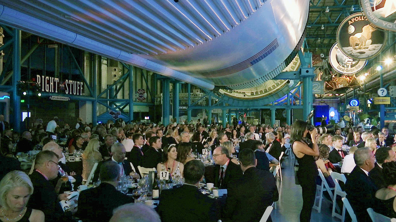 The black-tie Apollo Celebration Gala is held under a Saturn V rocket at the Kennedy Space Center in Cape Canaveral, Florida, on Saturday. (AP Photo/Alex Sanz)