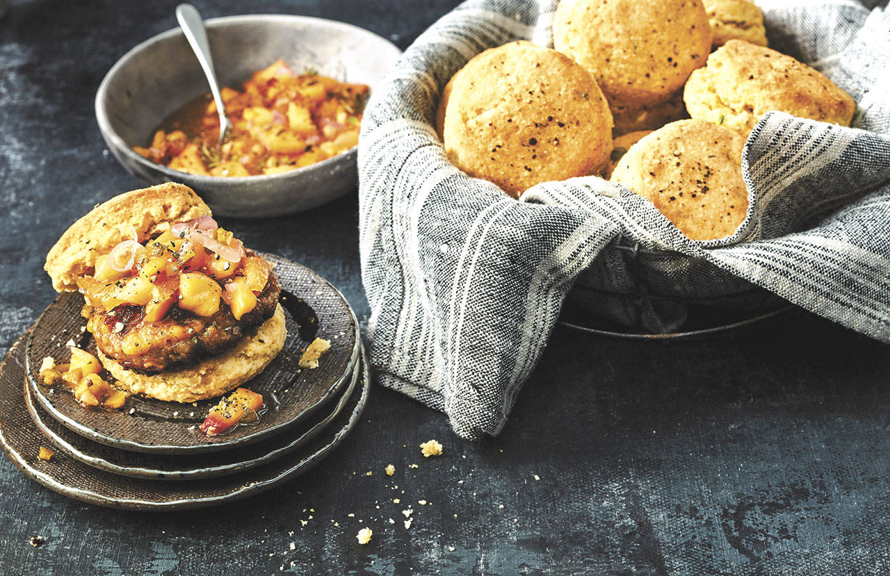 Serve breakfast sausage with ginger peach relish on top of Erika Council’s black pepper-thyme cornmeal biscuits. (Photo by Greg DuPree)
