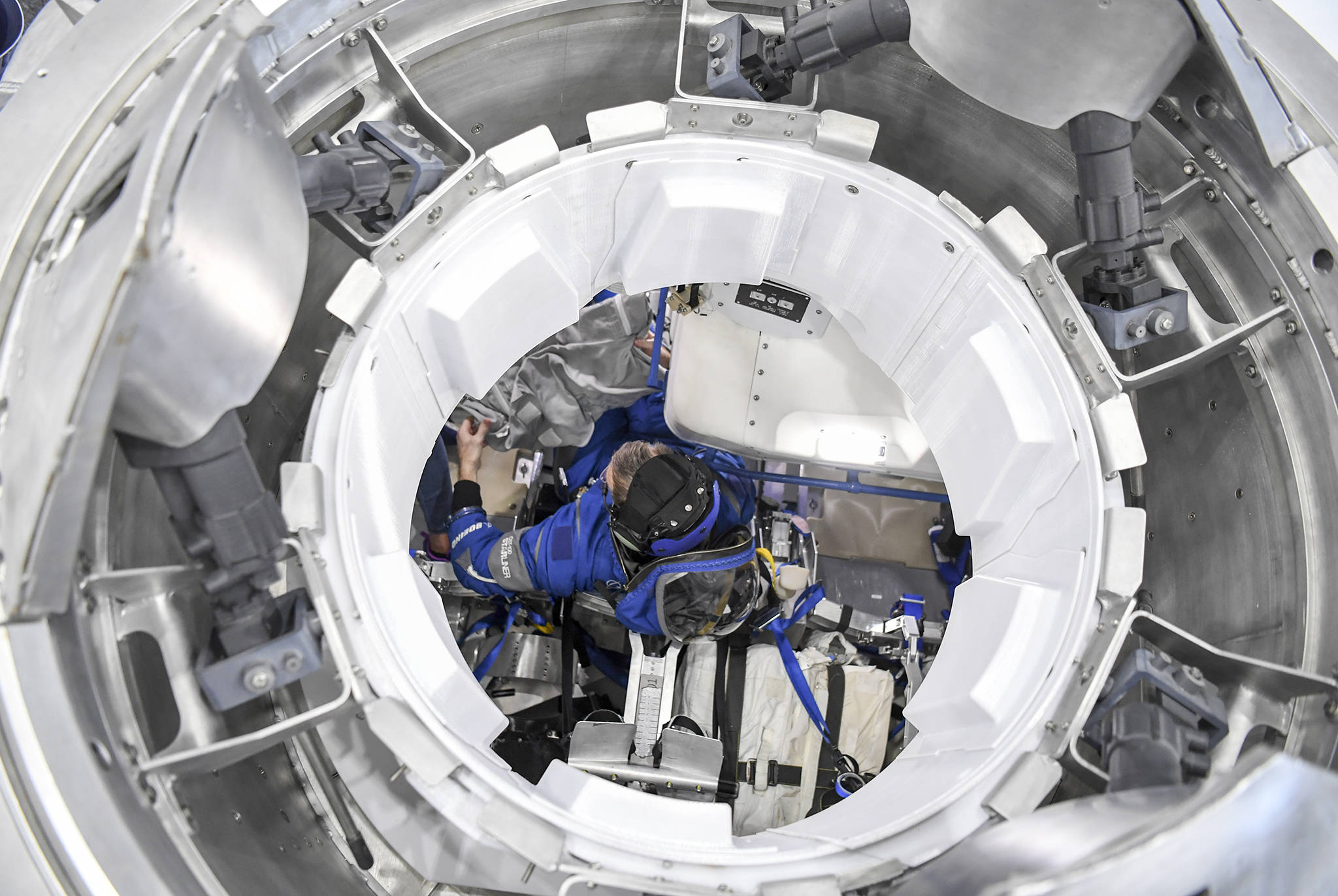 Astronaut Chris Ferguson trains in the Boeing Starliner mock-up at NASAs Johnson Space Center in Houston. (Jonathan Newton/Washington Post)