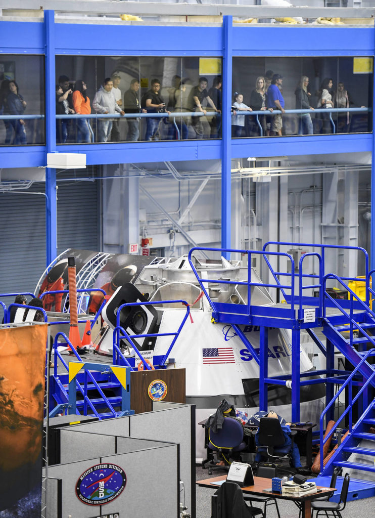 Visitors watch Chris Ferguson train at Johnson Space Center in Houston. (Jonathan Newton/Washington Post)
