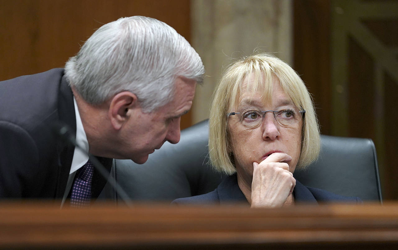Sen. Patty Murray Sen. Jack Reed talk as Education Secretary Betsy DeVos testifies during a hearing on Capitol Hill on June 5. (AP Photo/Carolyn Kaster, file)