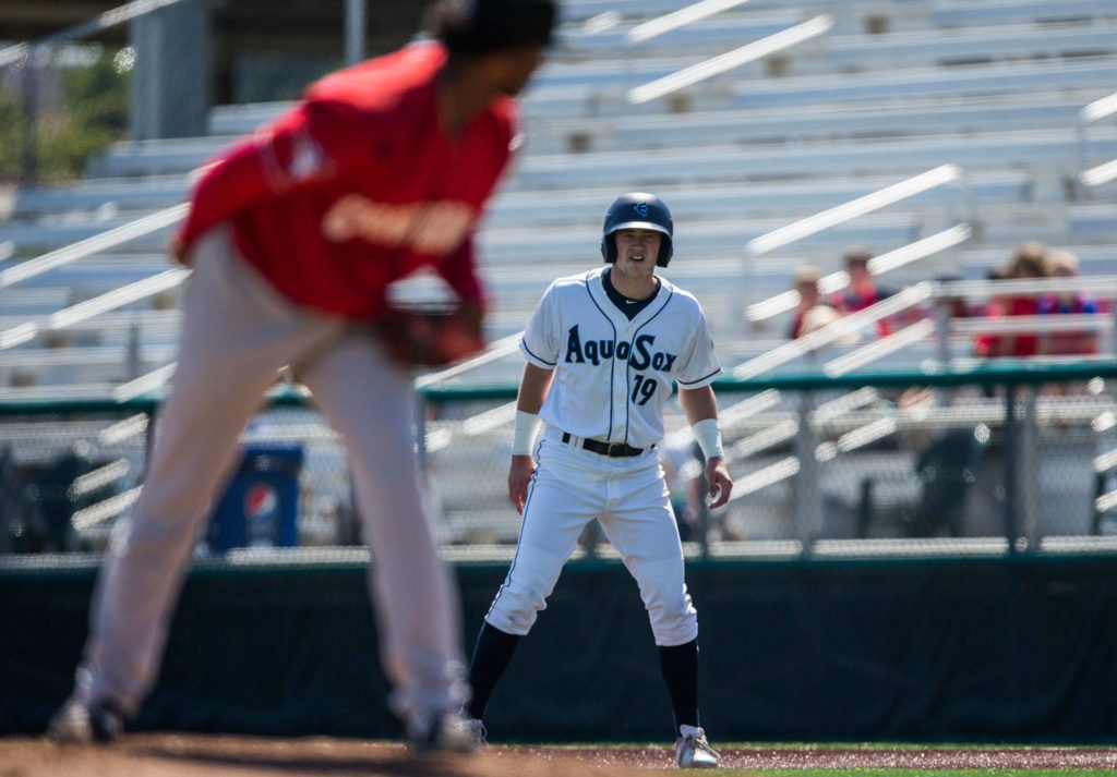 Aquasox’s Charlie McConnell makes eye contact with Vancouver’s pitcher during the game at Everett Memorial Stadium on Thursday, July 26, 2018 in Everett, Wa. (Olivia Vanni / The Herald)
