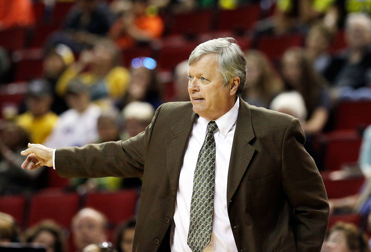 Seattle Storm coach Dan Hughes gestures during the Storm’s game against the Los Angeles Sparks on July 10 in Seattle. (Elaine Thompson / Associated Press)