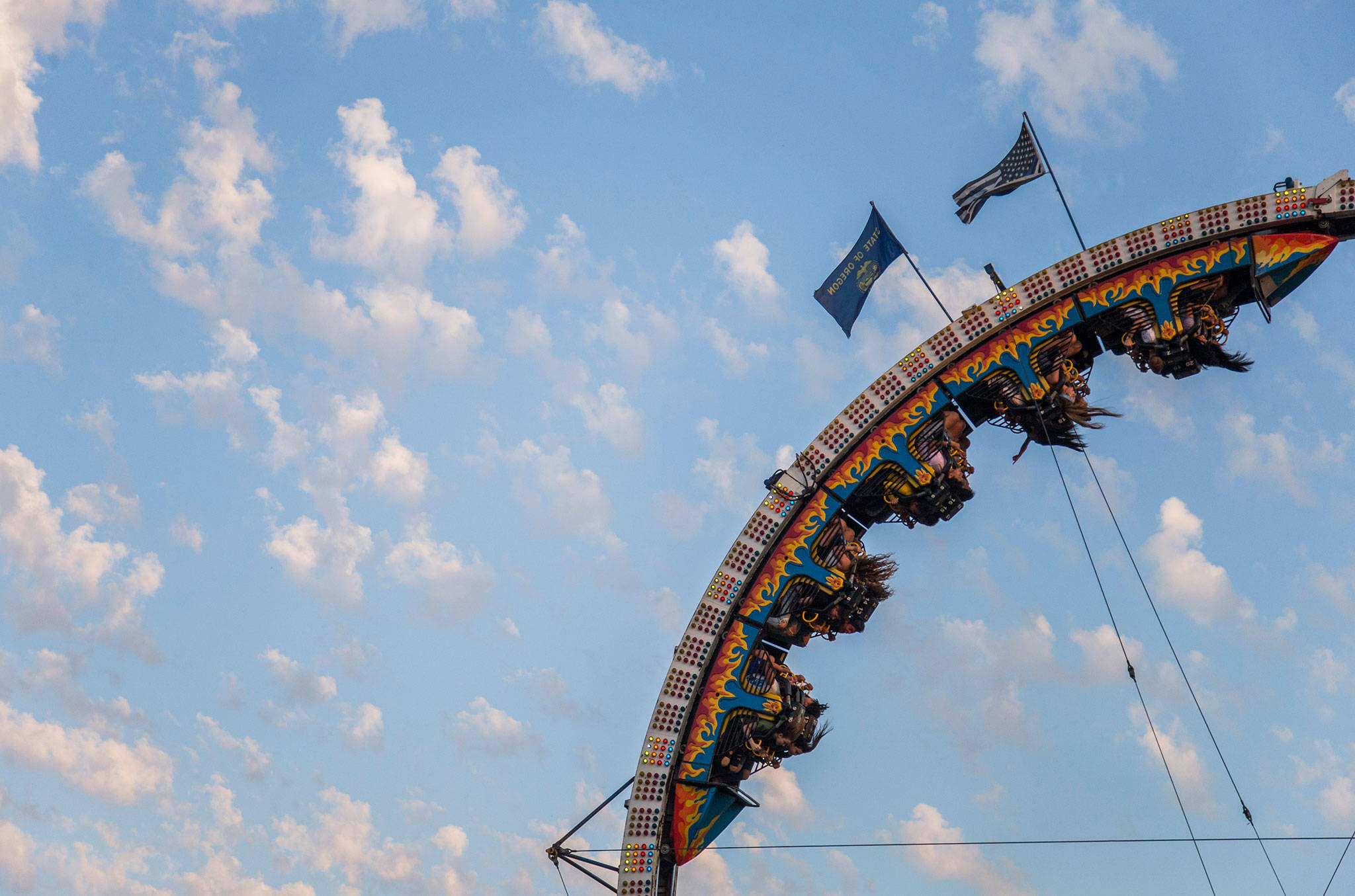 People ride the Vertical Loop during the Tour de Terrace carnival on Friday, July 27, 2018 in Mountlake Terrace, Wa. (Olivia Vanni / The Herald)