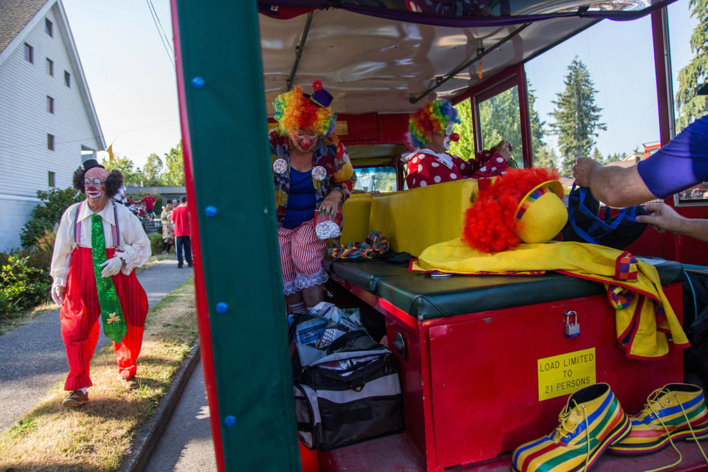 Shriner clowns get ready before the start of the Tour de Terrace parade on Friday, July 27, 2018 in Mountlake Terrace, Wa. (Olivia Vanni / The Herald)

