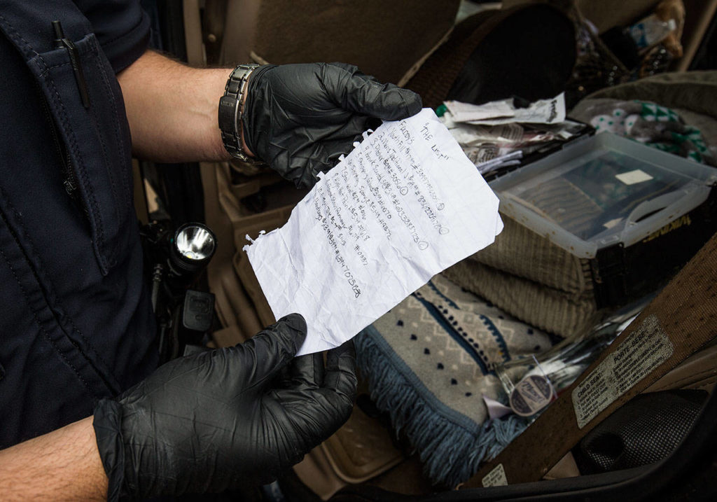 A rip sheet — showing the names of stores, barcode numbers, prices and UPC codes — was found during a search of a vehicle used by shoplifting suspects Thursday, June 14, 2018, in Monroe. Shoplifters find discarded receipts, then make rip sheets to help them organize their thefts. (Andy Bronson / The Herald)
