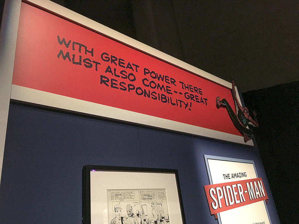 Several pieces of Spider-Man lore are on display in the Marvel exhibit at Museum of Pop Culture, including his famous motivation. (Ben Watanabe / The Herald)
