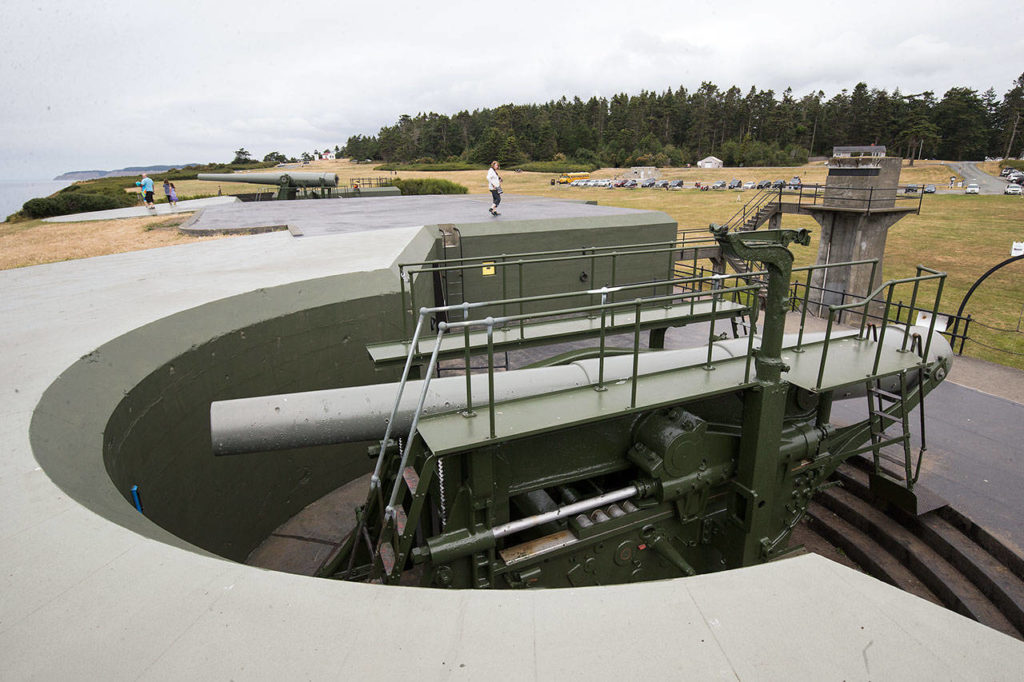 Visitors at Fort Casey State Park in Coupeville walk around the guns, the only 10-inch disappearing guns in the United States and two of four left in the world. An Aug. 11 event at the park will celebrate the 50th anniversary of the guns that are the same models as the originals. (Andy Bronson / The Herald)
