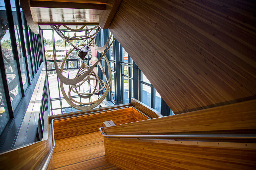 A large wood staircase is the focal point of the Washington State University Everett campus building on Wednesday, July 25, 2018 in Everett, Wa. (Olivia Vanni / The Herald)
