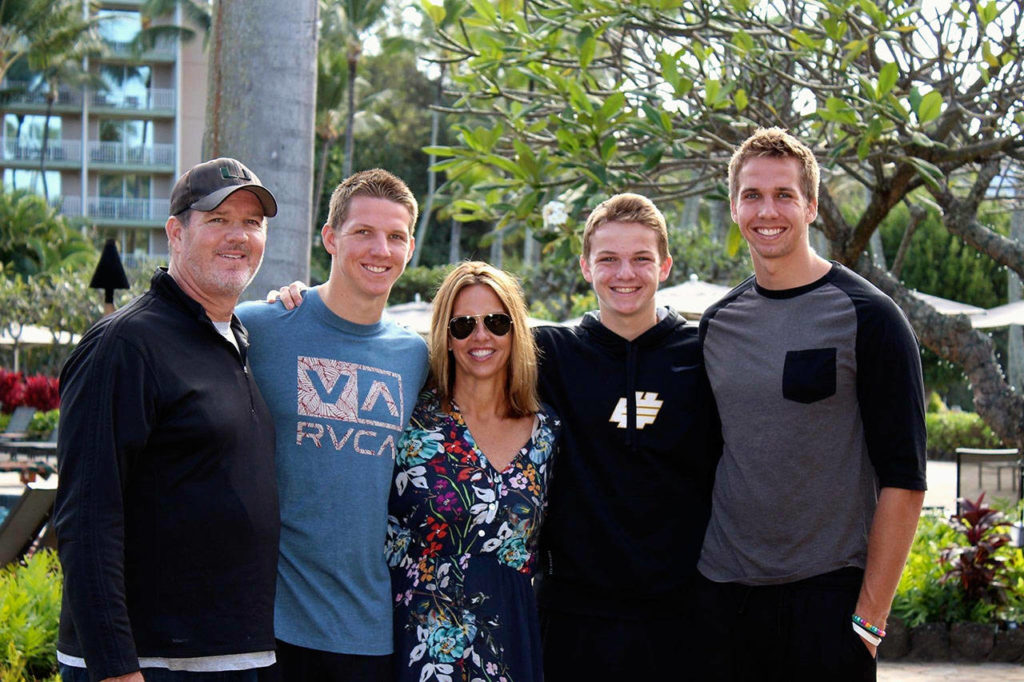 Kym Hilinski (center) with her family in Kauai, Hawaii, several years ago. Her husband, Mark (from left), son Tyler, Kym and sons Ryan and Kelly. Tyler’s mother and her nephews will be in Everett Saturday to throw out a ceremonial first pitch at the AquaSox game.
