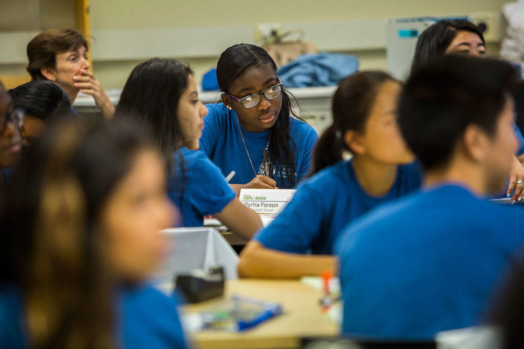 Portia Forson of Mariner High School listens to a lecture during the Fred Hutch Pathway Research Explorers Program at the Fred Hutchinson Cancer Research Center on Thursday, Aug. 9, 2018 in Seattle, Wa. (Olivia Vanni / The Herald)
