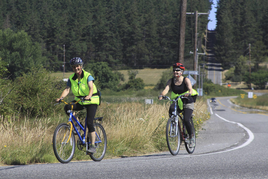 Riders make the final turn to head for the home stretch during the Sea, Trees, & Pie Bike Ride on July 22. (Whidbey Camano Land Trust)
