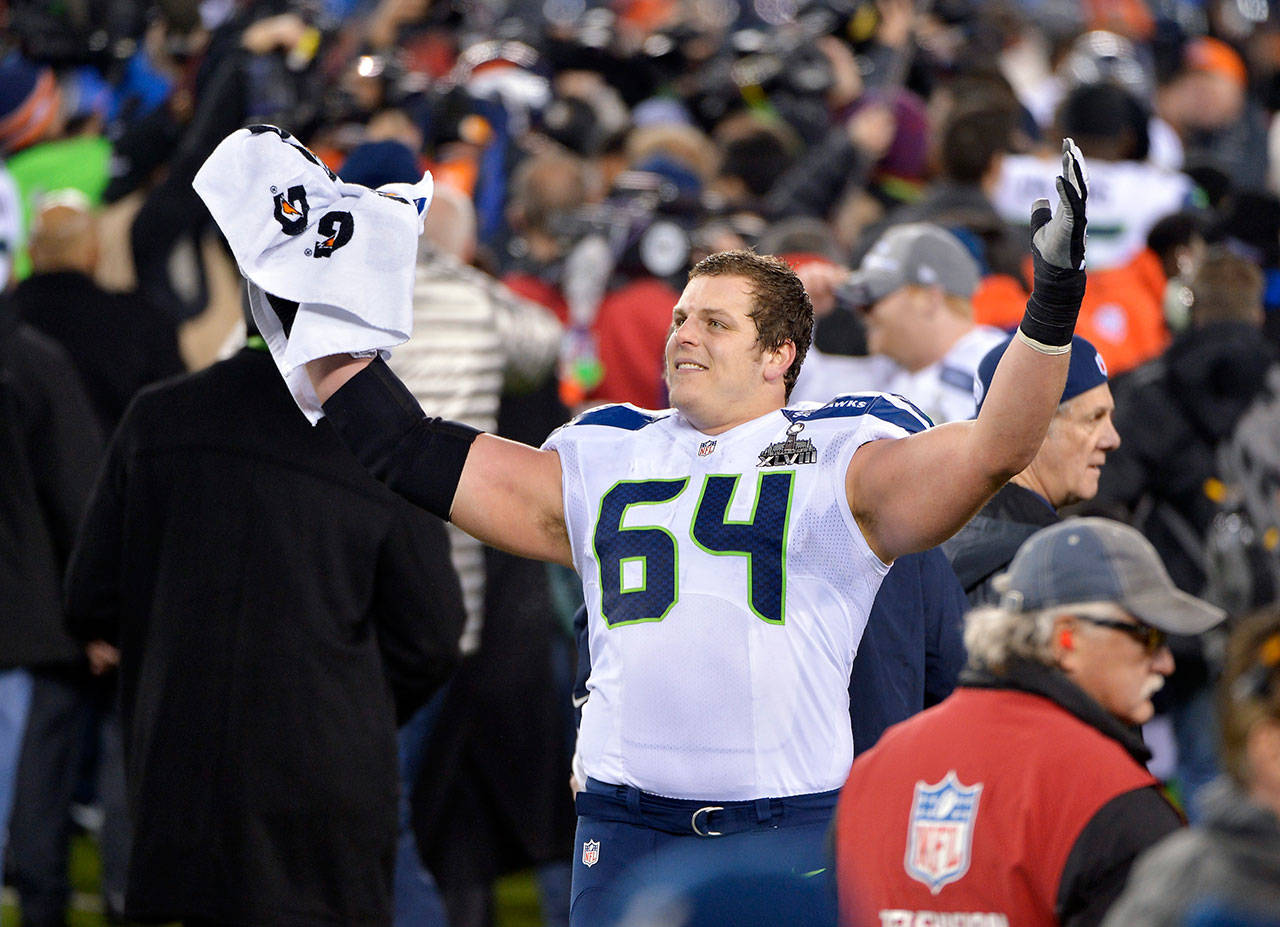 The Seahawks’ J.R. Sweezy (64) celebrates during the second half of Super Bowl XLVIII against the Broncos on Feb. 2, 2014, in East Rutherford, N.J. (AP Photo/Bill Kostroun)