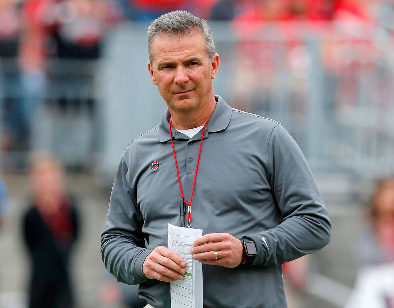 Ohio State football coach Urban Meyer watches the Buckeyes’ spring game April 14 in Columbus, Ohio. The school placed Meyer on paid administrative leave Wednesday. (AP Photo/Jay LaPrete, File)