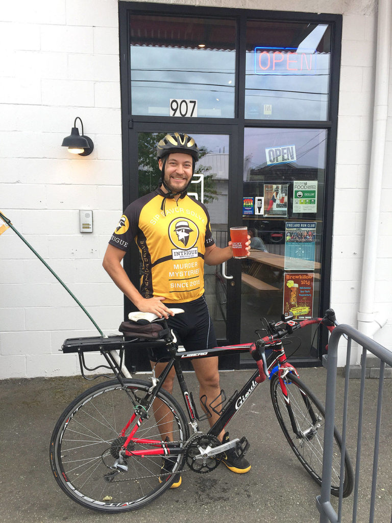 Andrew Bieber, aka the Cycling Cicerone, makes a stop at Lucky Envelope Brewing in Seattle. Bieber’s blog promotes biking and beer drinking. (Aaron Swaney)

