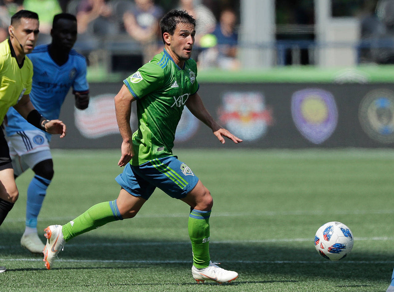 Seattle’s Nicolas Lodeiro looks to pass during the first half of a July 29 match at CenturyLink Field. (AP Photo/Ted S. Warren)