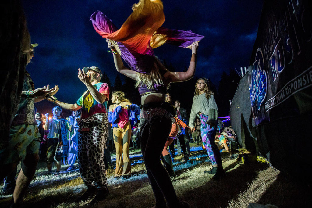 People dance during Twiddle’s performance at the Summer Meltdown on Thursday in Darrington. (Olivia Vanni / The Herald)
