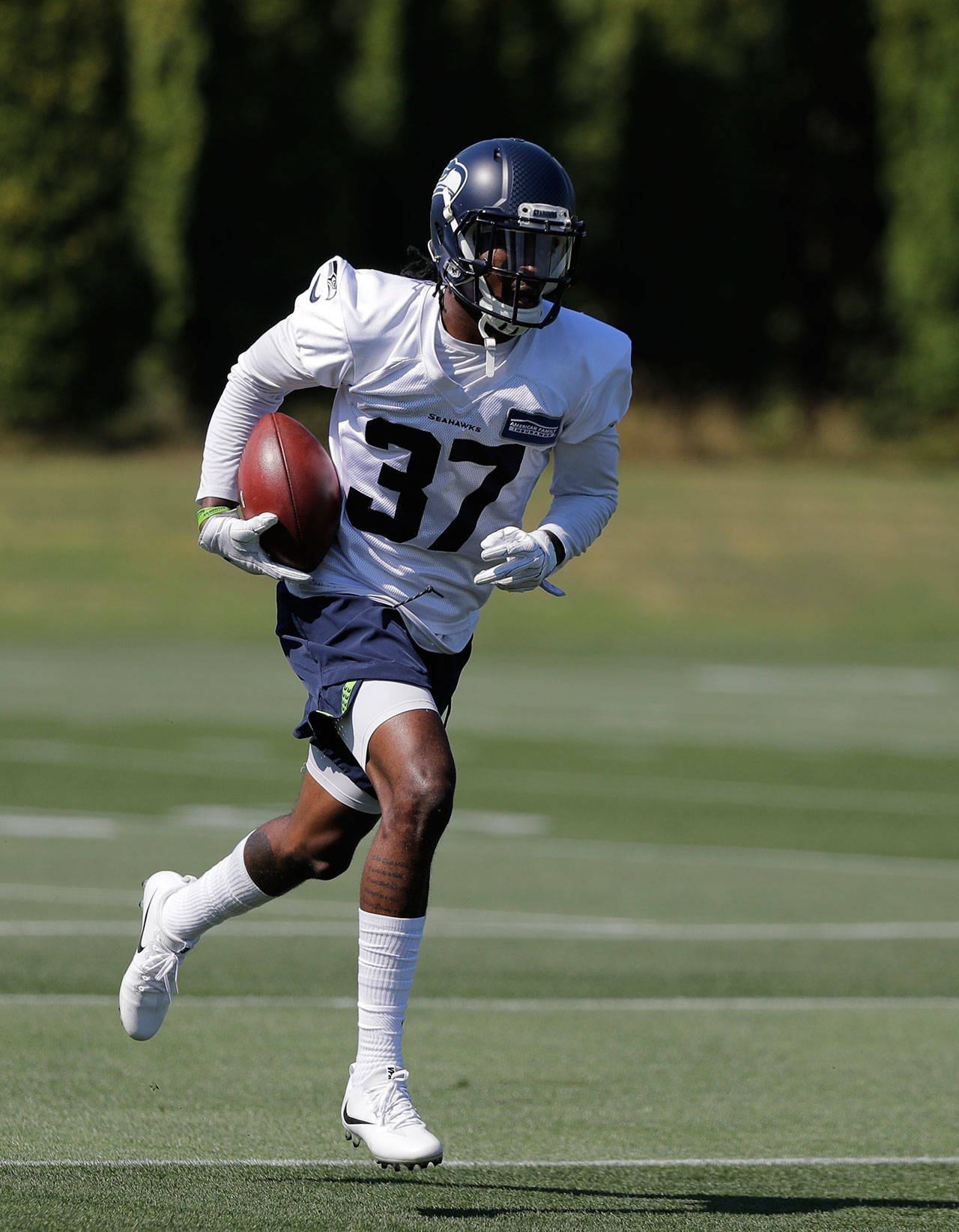 Seattle’s Tre Flowers runs during a July 26 training camp session in Renton. (AP Photo/Ted S. Warren)