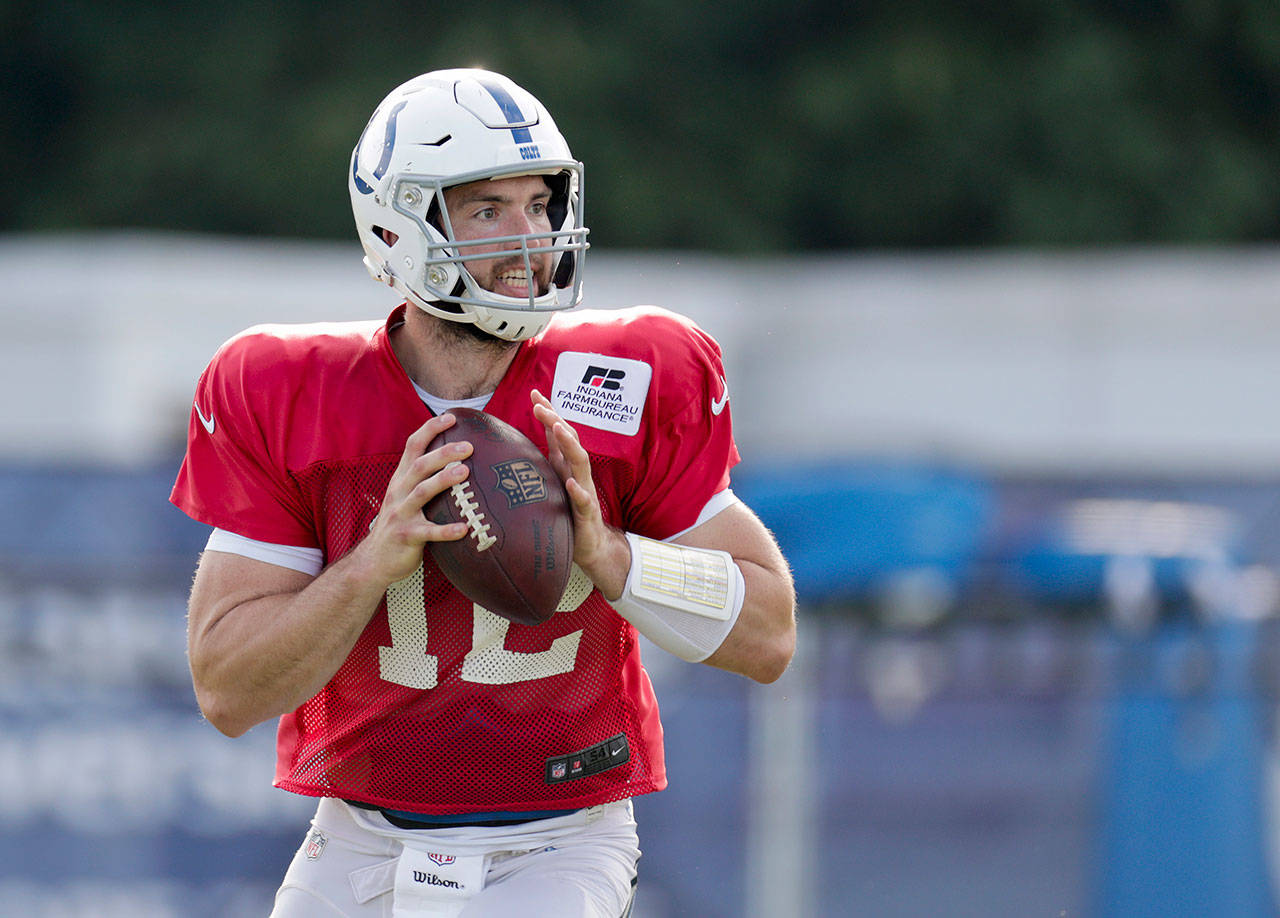 Indianapolis quarterback Andrew Luck (12) throws during the Colts’ practice Sunday in Westfield, Indiana. (AP Photo/Michael Conroy)